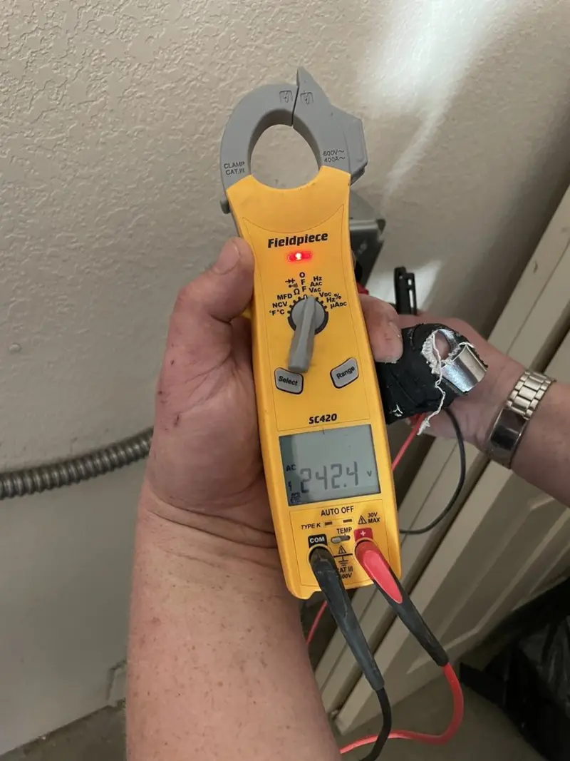 Voltage testing with clamp meter during Whole House Surge Protector in York